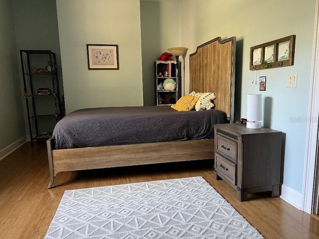 bedroom featuring wood-type flooring