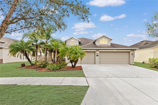 view of front of property with a front yard and a garage