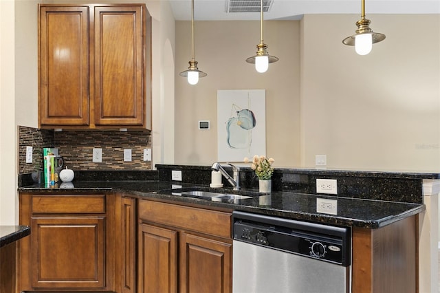 kitchen featuring dishwasher, backsplash, dark stone counters, sink, and decorative light fixtures