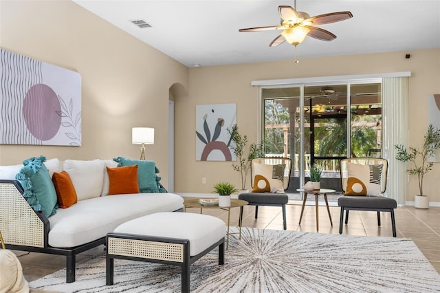 living room with ceiling fan and light tile patterned flooring