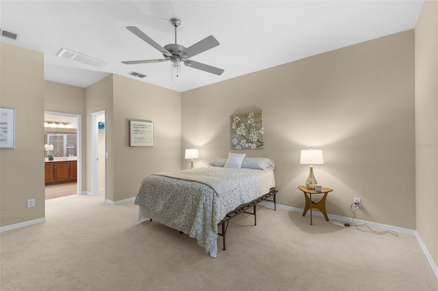 carpeted bedroom with connected bathroom and ceiling fan