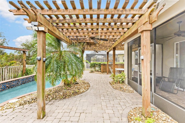 view of patio / terrace featuring ceiling fan and a pergola