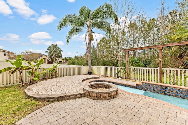 view of patio / terrace with an outdoor fire pit