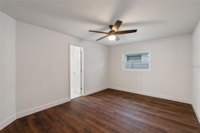 unfurnished room featuring dark hardwood / wood-style floors, ceiling fan, and a textured ceiling