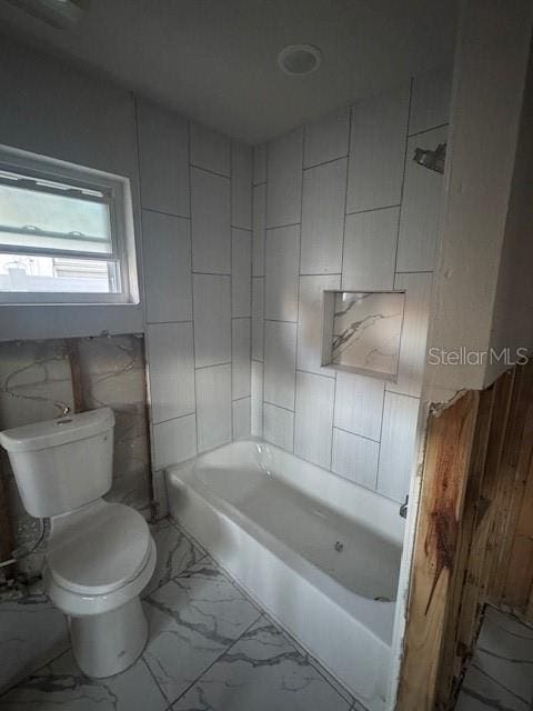 bathroom featuring  shower combination and toilet