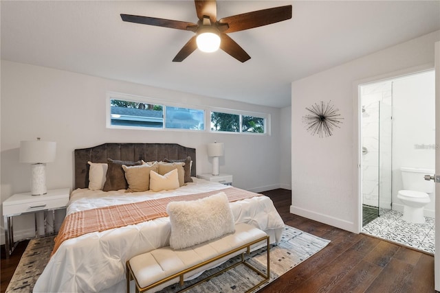 bedroom featuring ceiling fan, dark wood-type flooring, and ensuite bathroom