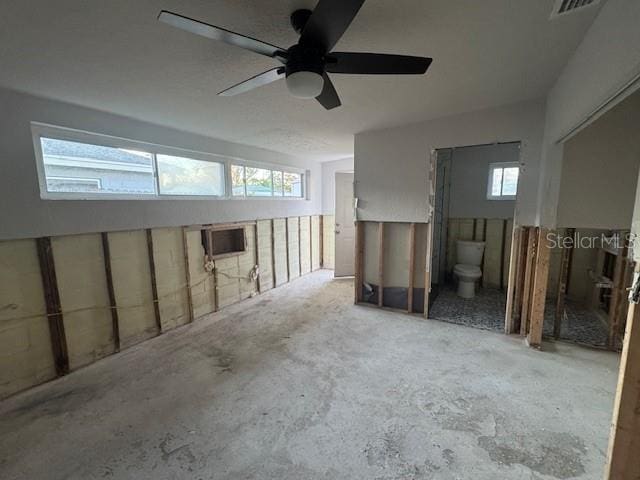 interior space featuring ceiling fan