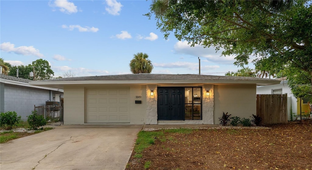 single story home featuring a garage