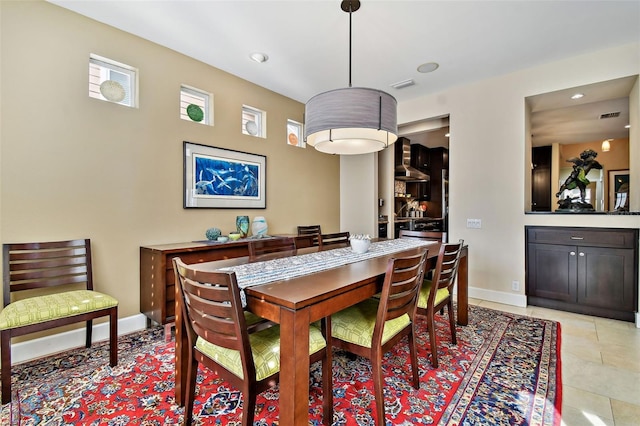 dining area with light tile patterned flooring