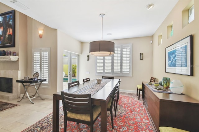 dining room featuring french doors and light tile patterned flooring