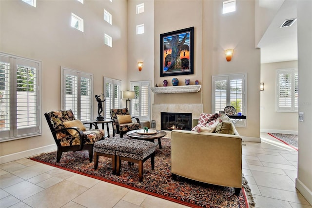 living room featuring a high ceiling and light tile patterned floors