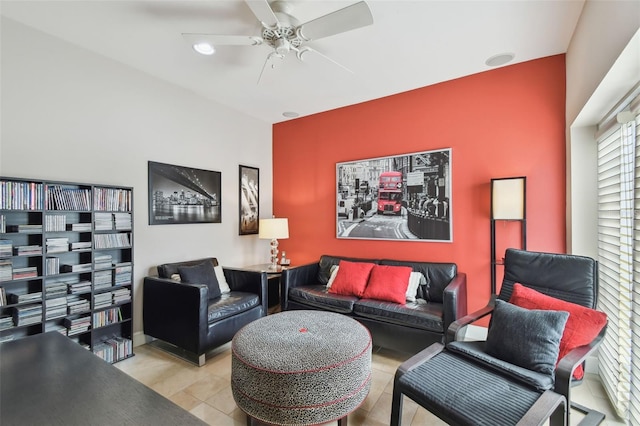 living room featuring ceiling fan and light tile patterned floors