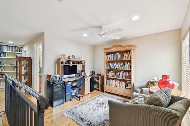 office with ceiling fan, a wealth of natural light, and light hardwood / wood-style floors