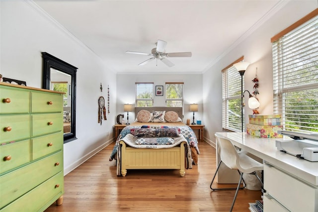 bedroom with ceiling fan, crown molding, light hardwood / wood-style floors, and multiple windows