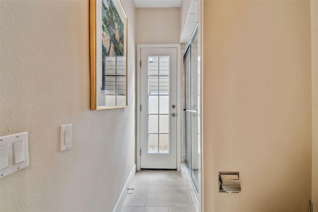 entryway featuring light tile patterned floors