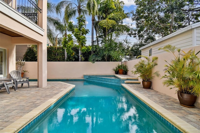 view of swimming pool featuring a patio