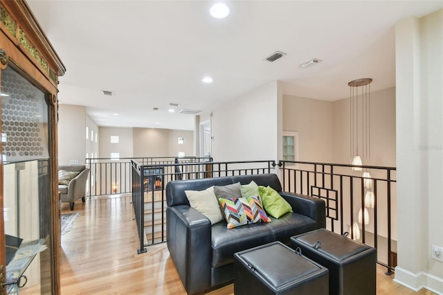 living room with light hardwood / wood-style flooring