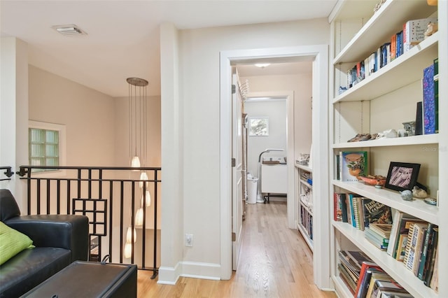 hallway featuring light hardwood / wood-style flooring