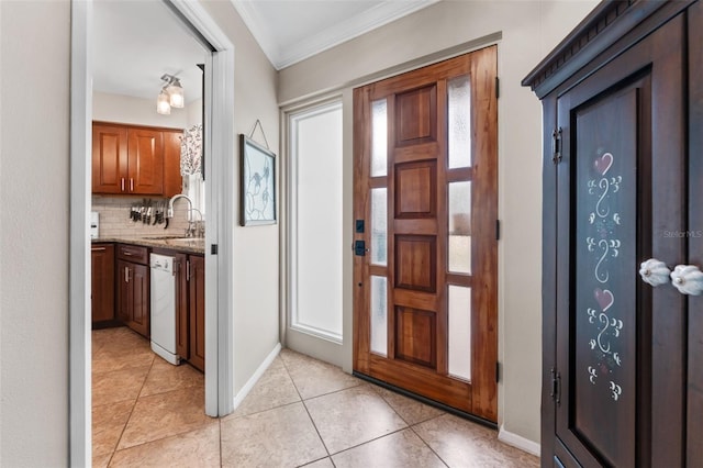 entryway featuring crown molding, light tile patterned floors, and sink