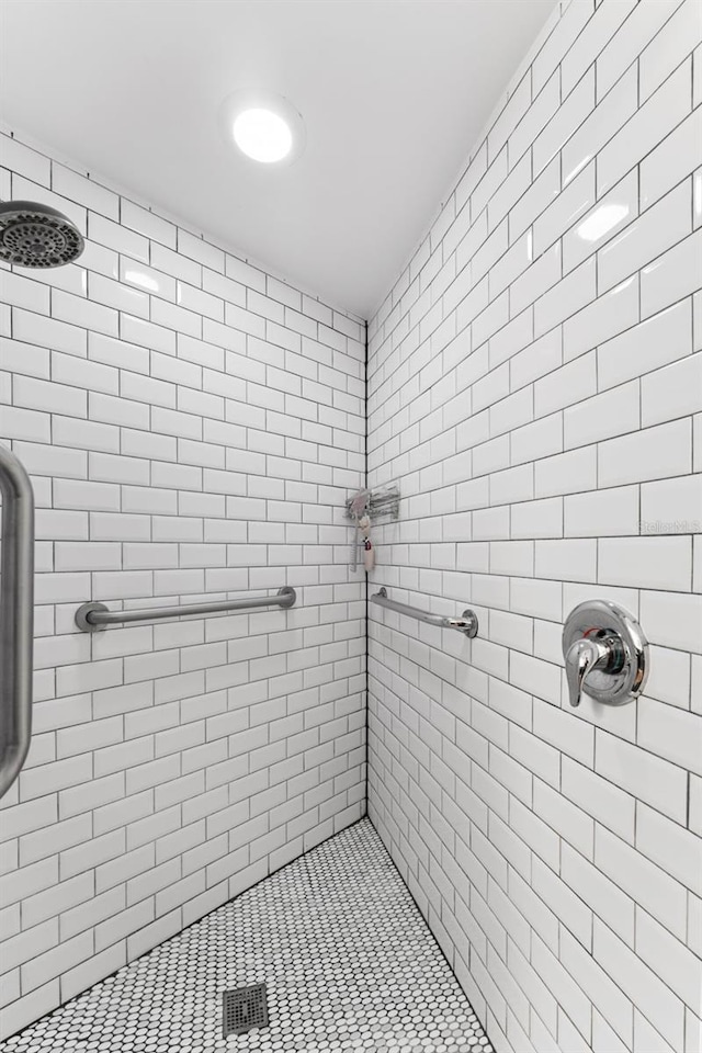 bathroom with a tile shower