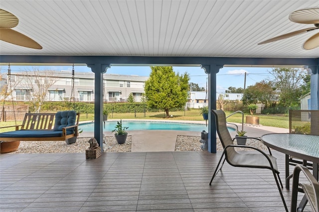 view of swimming pool featuring a patio and ceiling fan