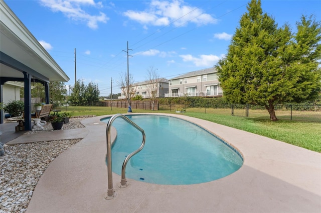 view of pool featuring a patio area and a lawn