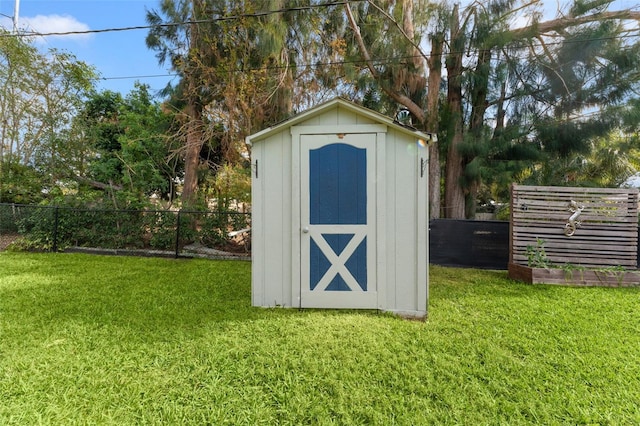 view of outdoor structure with a yard