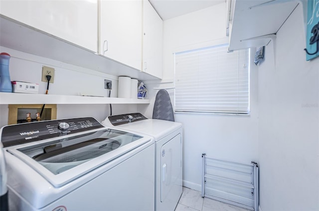 laundry area with cabinets and washing machine and dryer