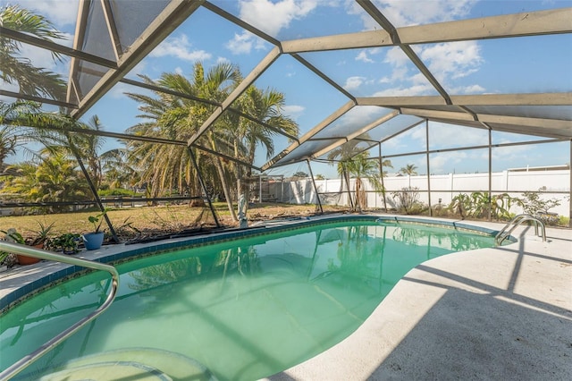 view of pool with a lanai and a patio area