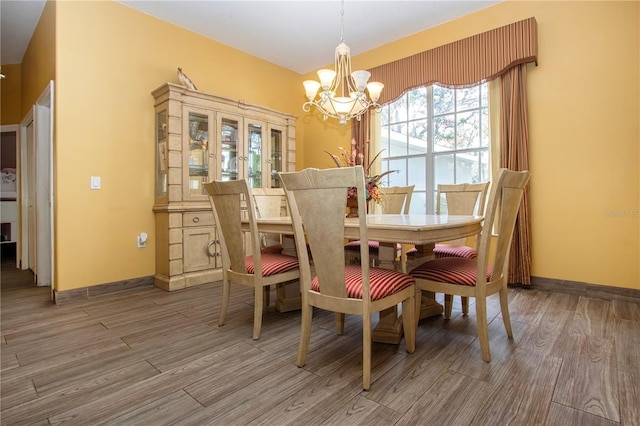 dining room featuring a chandelier and hardwood / wood-style flooring