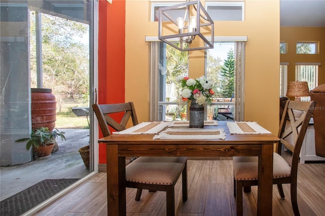 dining space featuring a chandelier and hardwood / wood-style flooring