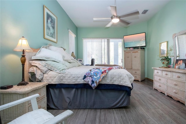 bedroom featuring hardwood / wood-style floors and ceiling fan