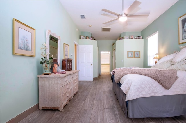 bedroom featuring light wood-type flooring and ceiling fan