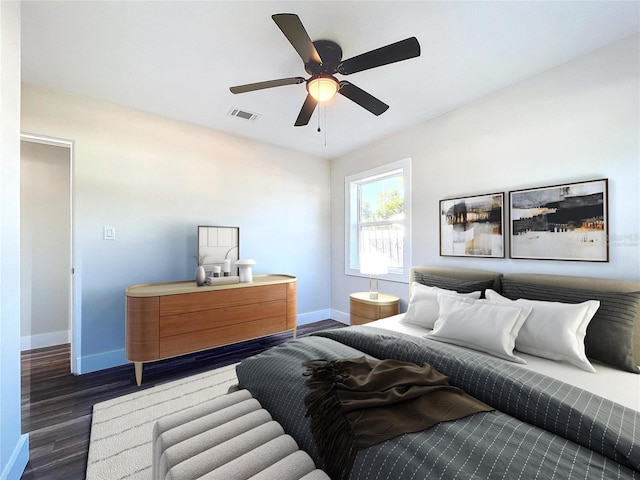 bedroom featuring ceiling fan and dark wood-type flooring