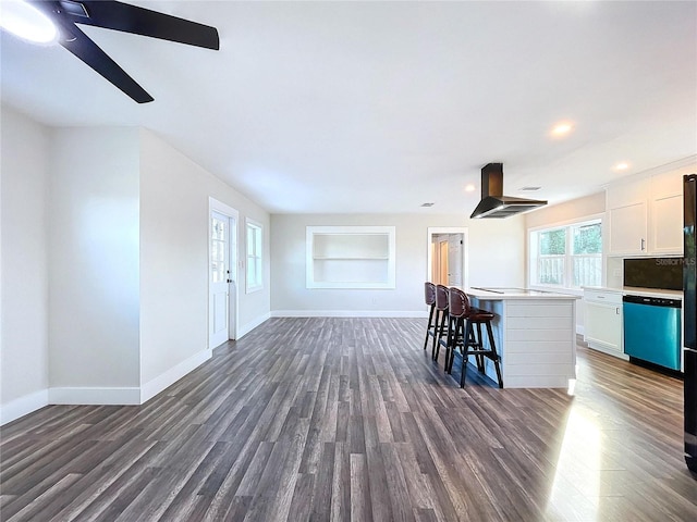 unfurnished living room featuring built in shelves and dark hardwood / wood-style floors