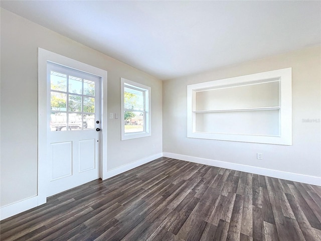 interior space with built in features and dark wood-type flooring