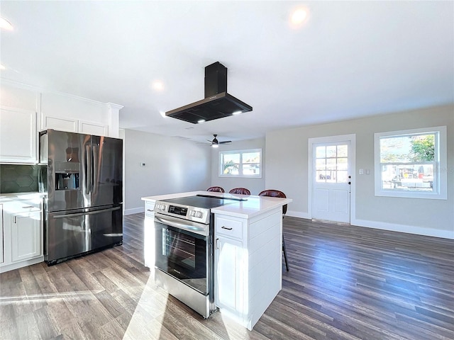 kitchen featuring white cabinets, appliances with stainless steel finishes, and island exhaust hood