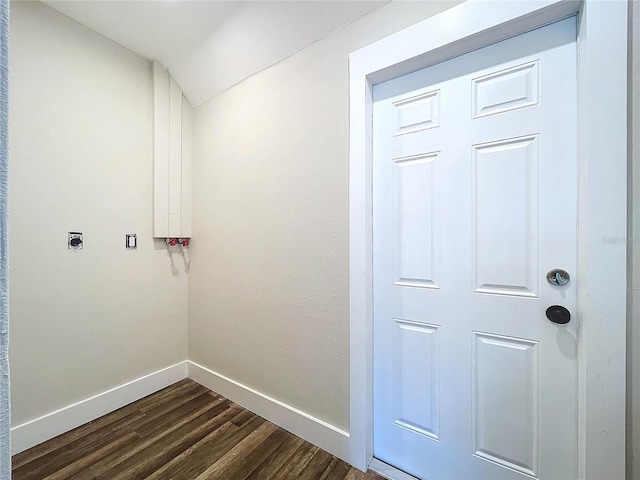 laundry room featuring electric dryer hookup and dark hardwood / wood-style flooring