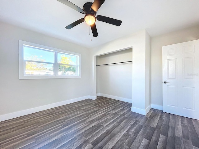 unfurnished bedroom with a closet, ceiling fan, and dark hardwood / wood-style floors