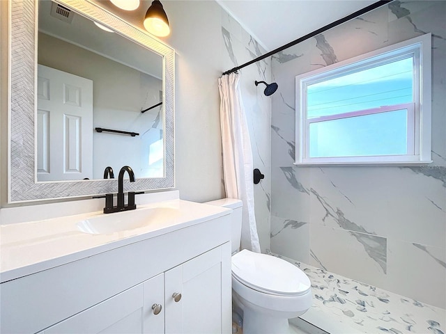 bathroom with a shower with curtain, toilet, and vanity