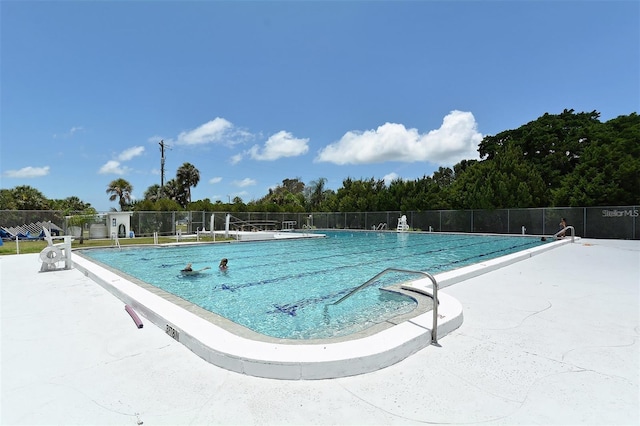 view of swimming pool with a patio area