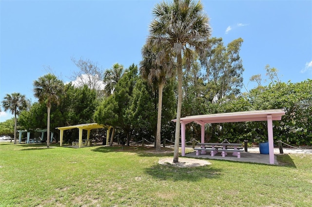 view of property's community with a lawn