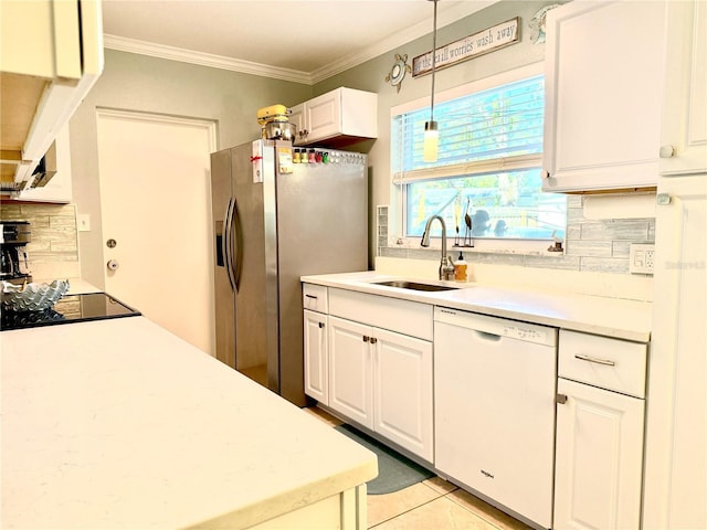 kitchen with white dishwasher, sink, stainless steel refrigerator with ice dispenser, decorative light fixtures, and white cabinetry