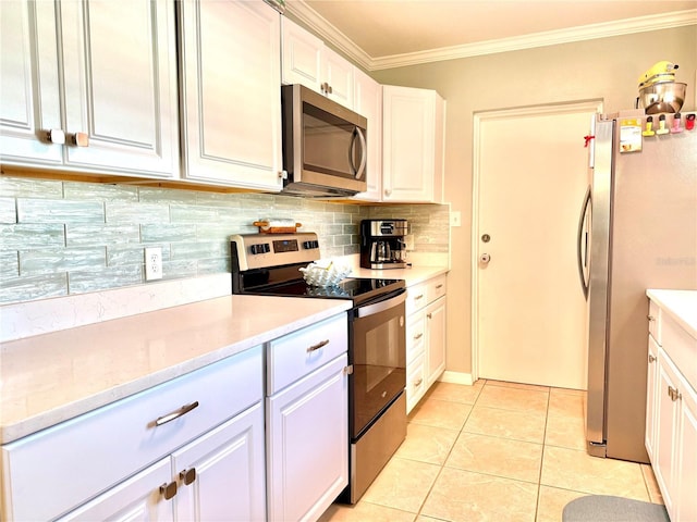 kitchen featuring light tile patterned floors, white cabinetry, and appliances with stainless steel finishes