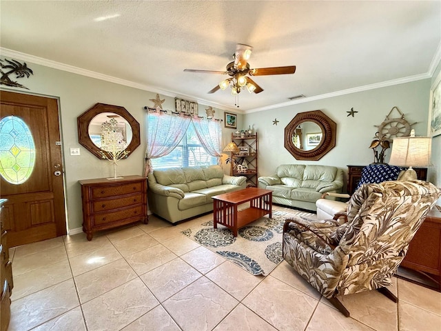 living room with light tile patterned floors, a textured ceiling, ceiling fan, and ornamental molding