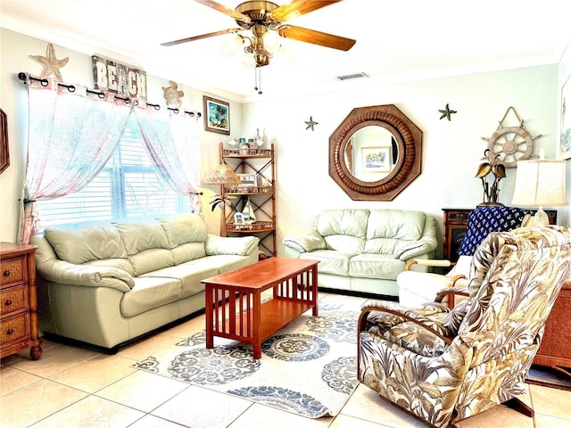 living room with ceiling fan, light tile patterned floors, and ornamental molding