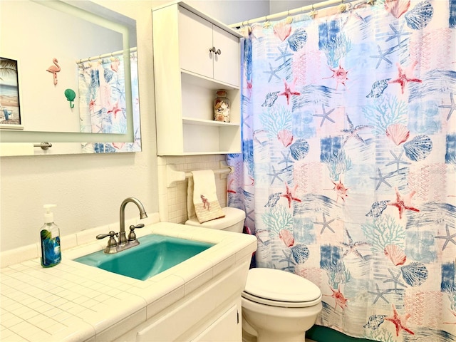 bathroom featuring decorative backsplash, vanity, toilet, and a shower with shower curtain