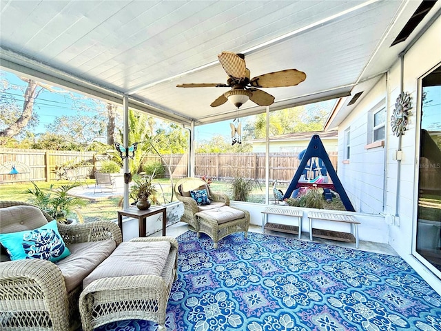 sunroom with ceiling fan and a healthy amount of sunlight