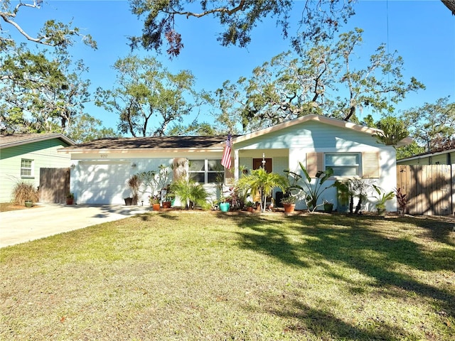 back of house with a yard and a garage