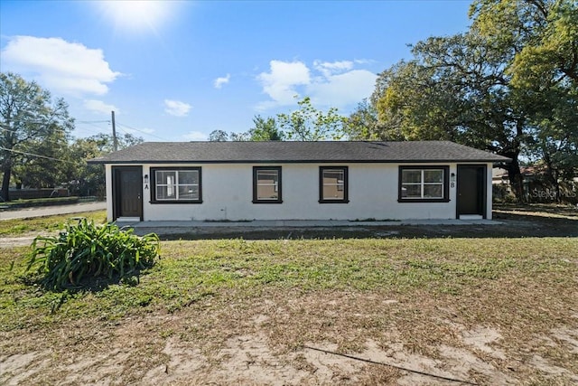 view of side of home featuring a yard